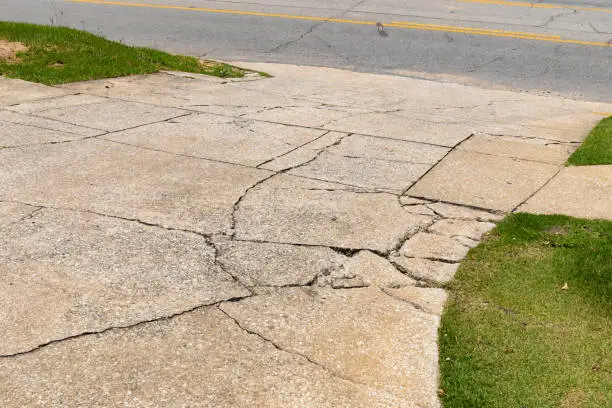 image of a worn, cracked driveway